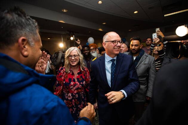 October 26, 2022, Winnipeg, MB, Canada: Scott Gillingham, right, makes an entrance with his wife, Marla Gillingham, as he celebrates with supporters after being declared the next mayor of Winnipeg, on Wednesday, October 26, 2022. Winnipeg Canada  - ZUMAc35_ 20221026_zaf_c35_169 Copyright: xDanielxCrumpx