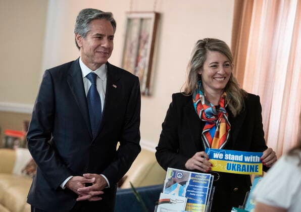 October 27, 2022, Ottawa, ON, CAN: Minister of Foreign Affairs Mo lanie Joly holds a sticker in support of Ukraine as she tours Cafe Ukraine with U.S. Secretary of State Antony Blinken during his official visit to Canada, in Ottawa on Thursday, Oct. 27, 2022. Ottawa CAN  - ZUMAc35_ 20221027_zaf_c35_017 Copyright: xJustinxTangx