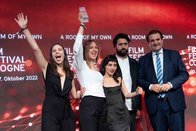 from left actress Taki MUMLADZE, producer Eva BLONDIAU, actress Mariam KHUNLADZE and producer Elmar IMANOV receive the Film Award NRW for their film A ROOM OF MY OWN, right laudator Nathanael LIMINSKI, head of the State Chancellery NRW, Film Festival Cologne awards in Cologne, 27 10 2022