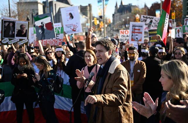October 29, 2022, Ottawa, ON, CANADA: Canadian Prime Minister Justin Trudeau speaks to demonstrators in Ottawa on Saturday, Oct. 29, 2022. Scores of demonstrators lined the streets of several major Canadian cities Saturday as part of a worldwide human chain organized by the Association of Families of Flight PS752 Victims in solidarity with antigovernment protesters in Iran. Ottawa CANADA  - ZUMAc35_ 20221029_zaf_c35_039 Copyright: xJustinxTangx