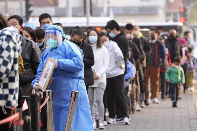 Zero COVID policy in China People line up for PCR tests in Beijing on Nov. 10, 2022, as authorities impose strict travel restrictions under the central government s zero COVID-19 policy.  A14AA0001353907P