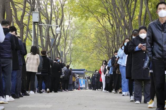 Zero COVID policy in China People line up for PCR tests in Beijing on Nov. 10, 2022, as authorities impose strict travel restrictions under the central government s zero COVID-19 policy.  A14AA0001353909P