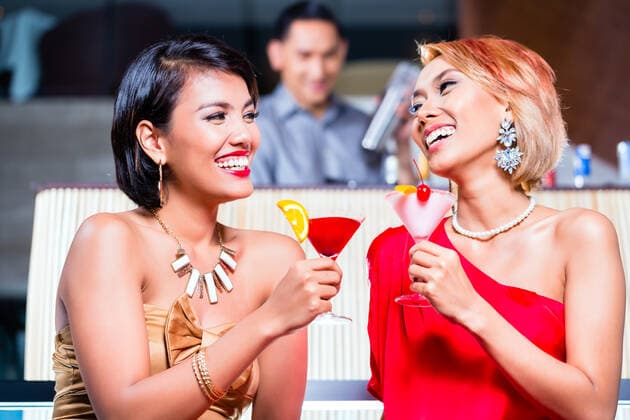 RECORD DATE NOT STATED Asian women drinking cocktails in fancy bar, model released, , 36325646.jpg, Asian, Restaurant, Bar, club, party, celebration, Fine, Cocktails, Couple, Man, Woman, Fancy, spacious, sophisticated, romance, happy, glasses, barman, bartender, mixing, Asia, Indonesia, Indonesian, people, adult