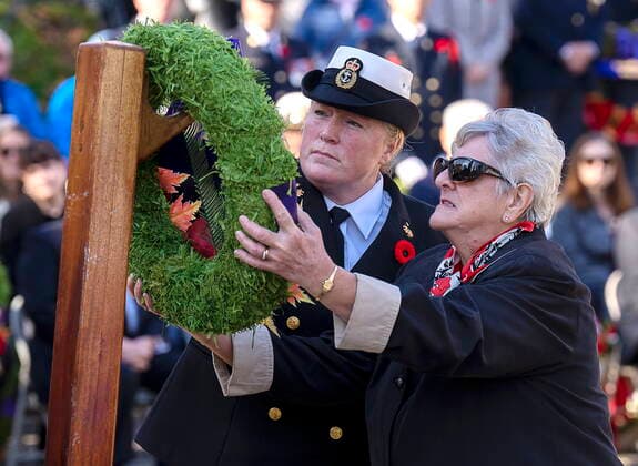 November 11, 2022, Halifax, NS, Canada: Memorial Cross Mother Charlotte Smith, right, is assisted by Chief Petty Officer Second Class Lynn Cassidy at Remembrance Day ceremonies at the Grand Parade in Halifax on Friday, Nov. 11, 2022. Her son Pte. Nathan Smith was killed in Afghanistan in April 2002 along with three other soldiers. They were the first Canadians to die in the war. Halifax Canada  - ZUMAc35_ 20221111_zaf_c35_015 Copyright: xAndrewxVaughanx