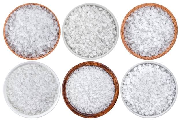 Top view of sea salt isolated on white background Top view of sea salt isolated on white background closeup Copyright: xZoonar.com MaksimxLashcheuskix 13429105