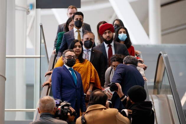 November 14, 2022, TORONTO, ON, CANADA: Federal Transport Minister Omar Alghabra, bottom left, rides on an escalator as he heads to a news conference alongside India s Consul General Apoorva Srivastava, second from left, at the Pearson International Airport in Toronto Monday, Nov. 14, 2022. TORONTO CANADA - ZUMAc35_ 20221114_zaf_c35_072 Copyright: xColexBurstonx