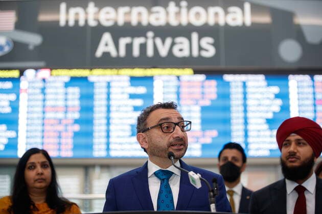November 14, 2022, TORONTO, ON, CANADA: Federal Transport Minister Omar Alghabra speaks at a news conference alongside India s Consul General Apoorva Srivastava, at left, at the Pearson International Airport in Toronto Monday, Nov. 14, 2022. TORONTO CANADA  - ZUMAc35_ 20221114_zaf_c35_073 Copyright: xColexBurstonx