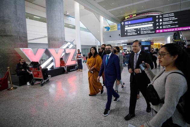 November 14, 2022, TORONTO, ON, CANADA: Federal Transport Minister Omar Alghabra arrives at a news conference alongside India s Consul General Apoorva Srivastava, at left, at the Pearson International Airport in Toronto Monday, Nov. 14, 2022. TORONTO CANADA  - ZUMAc35_ 20221114_zaf_c35_088 Copyright: xColexBurstonx
