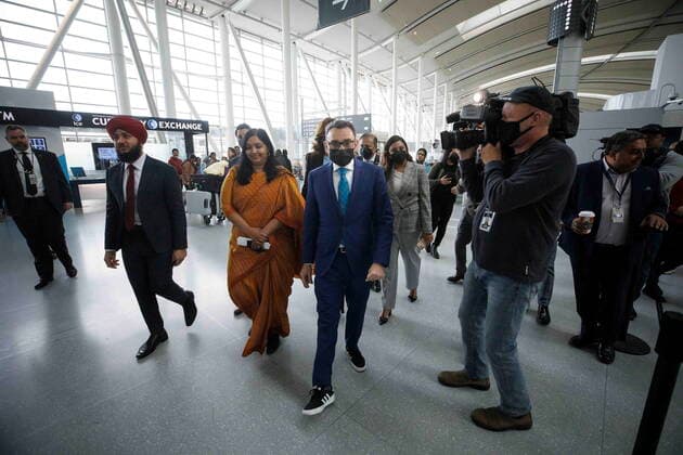 November 14, 2022, TORONTO, ON, CANADA: Federal Transport Minister Omar Alghabra arrives at a news conference alongside India s Consul General Apoorva Srivastava, at left, at the Pearson International Airport in Toronto Monday, Nov. 14, 2022. TORONTO CANADA  - ZUMAc35_ 20221114_zaf_c35_089 Copyright: xColexBurstonx