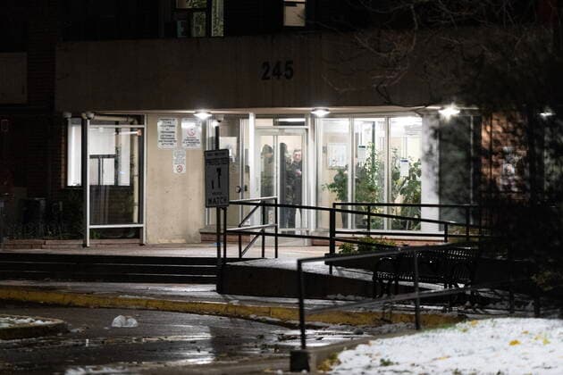 November 15, 2022, TORONTO, ON, CANADA: Police are seen in the entrance to 245 Dunn Ave during a shooting investigation in Toronto, Tuesday, Nov. 15, 2022. Police say one person is dead and three others have been injured after shots rang out in an apartment building on Dunn Ave near Queen St West. TORONTO CANADA  - ZUMAc35_ 20221115_zaf_c35_189 Copyright: xArlynxMcadoreyx