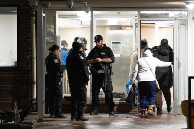 November 15, 2022, TORONTO, ON, CANADA: Police stand guard as they allow residents of 245 Dunn Ave to return home following a quadruple shooting, in Toronto, Tuesday, Nov. 15, 2022. Police say one person is dead and three others have been injured after shots rang out in an apartment building on Dunn Ave near Queen St West. TORONTO CANADA  - ZUMAc35_ 20221115_zaf_c35_194 Copyright: xArlynxMcadoreyx