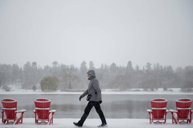 November 16, 2022, Ottawa, ON, Canada: A person makes their way along DowöÄÃ s Lake in Ottawa on Wednesday, Nov., 16, 2022. According to Environment Canada a winter weather travel advisory is in effect with snowfall amounts reaching 5 cm, the first significant snowfall of the season. Ottawa Canada  - ZUMAc35_ 20221116_zaf_c35_039 Copyright: xSpencerxColbyx