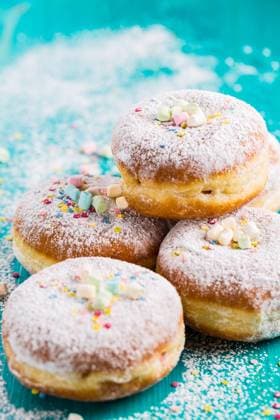 Carnival powdered sugar raised donuts - German Berliner donuts Carnival powdered sugar raised donuts - German Berliner donuts, Krapfen filled with jam Copyright: xZoonar.com IngridxBalabanovax 15071315