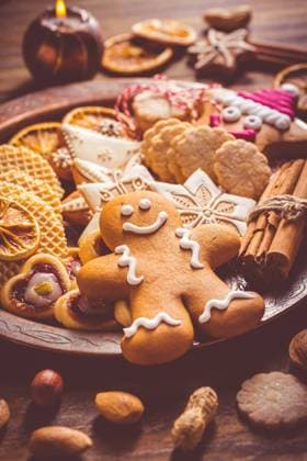 Variation of Christmas cookies Variation of Christmas cookies, gingerbread man and nuts with candle and ornaments Copyright: xZoonar.com IngridxBalabanovax 18068766