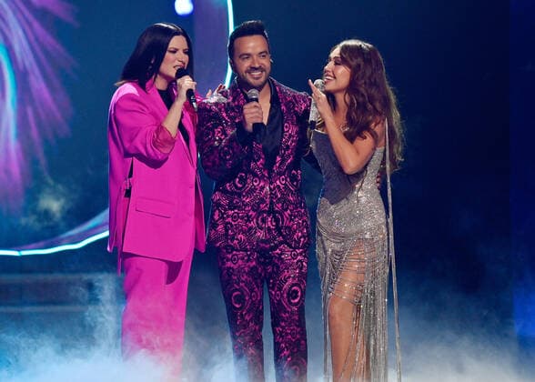 (L-R) Brazilian singer Anitta, Puerto Rican singer-songwriter Luis Fonsi and Italian singer-songwriter Laura Pausini perform onstage during the 23rd annual Latin Grammy Awards at the Michelob Ultra Arena at Mandalay Bay Resort and Casino in Las Vegas, Nevada on Thursday, November 17, 2022.  LAV20221117001 JIMxRUYMEN