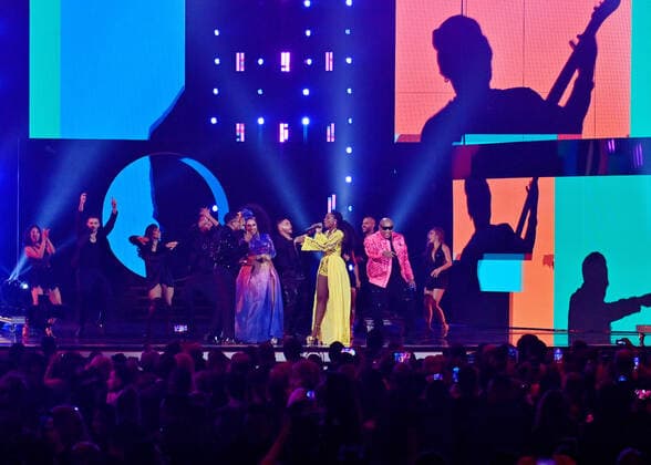 Goyo (C), Cuban singer Aymee Nuviola (L) and Gente de Zona perform onstage during the 23rd annual Latin Grammy Awards at the Michelob Ultra Arena at Mandalay Bay Resort and Casino in Las Vegas, Nevada on Thursday, November 17, 2022.  LAV20221117003 JIMxRUYMEN