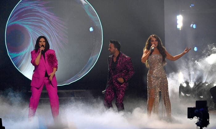 (L-R) Co-hosts Laura Pausini, Luis Fonsi and Thalía perform onstage during the 23rd annual Latin Grammy Awards at the Michelob Ultra Arena at Mandalay Bay Resort and Casino in Las Vegas, Nevada on Thursday, November 17, 2022.  LAV20221117615 JIMxRUYMEN