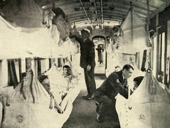 RECORD DATE NOT STATED Red Cross Train , (1919). Creator: Unknown. Copyright:xtransporte,transporte,povos,macho,interior,trabalho,homem,homens,hospital,medicina,trem,ciência,guy,ocupação,cama,quarto,estradaxdexferro,guerra,século,hammock,hammocks,doutor,profissão,paraxdentro,divisão,soldados,soldado,ferida,primeiraxguerraxdexmundo,conceito,ferido,ferimento,B&W,médico,MONOCROMÁTICO,ferido,CruzxVermelha,beliche,World.war.i,WWI,Dentro,,pretox&xbranco,pretoxexbranco,B W,GuerraxDexMundoxUma,1910s,20oxséculo,ThexPrintxCollector,photograph,Unknown,Knight,bedxchamber,CaxtonxPublishingxCompany,WilliamxStanleyxMacbeanxKnight,WilliamxStanleyxMacbean,W.xStanleyxMacbeanxKnight,WxStanleyxMacbeanxKnight,W.xStanleyxMacbean,WxStanleyxMacbean,W.xS.xM.,W.xS.xM.xKnight,CaxtonxPulis  Copyright:transporte,transporte,povos,macho,interior,trabalho,homem,homens,hospital,medicina,trem,ciência,guy,ocupação,cama,quarto,estradaxdexferro,guerra,século,hammock,hammocks,doutor,profissão,para