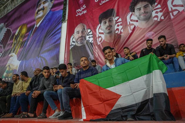 November 20, 2022, Gaza, Palestine: Thousands of Palestinians participated in attending the opening ceremony of the World Cup and attending the opening match between Qatar and Ecuador. The Qatari committee established a headquarters to display the matches throughout the World Cup for free in Saad Sayel Hall in the center of the Gaza Strip. The Palestinians in Gaza encouraged the national team And they sent motivational messages to the Qatari team via screens.  Copyright: xSaherxElghorrax
