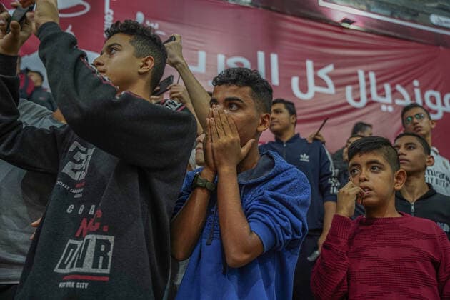 November 20, 2022, Gaza, Palestine: Thousands of Palestinians participated in attending the opening ceremony of the World Cup and attending the opening match between Qatar and Ecuador. The Qatari committee established a headquarters to display the matches throughout the World Cup for free in Saad Sayel Hall in the center of the Gaza Strip. The Palestinians in Gaza encouraged the national team And they sent motivational messages to the Qatari team via screens.  Copyright: xSaherxElghorrax