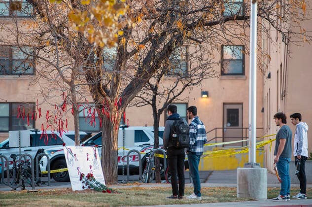November 20, 2022, Albuquerque, New Mexico, USA: Journal .Students stop to pay their respects at a memorial for the 19 year-old UNM student fatally shot on campus early Saturday morning. The shooting left a New Mexico State University MenÃ¢â‚¬â ¢s Basketball player wounded . Photographed on Sunday November 20, 2022 JOURNAL Albuquerque USA - ZUMAab1_ 20221120_zaf_ab1_005 Copyright: xAdolphexPierre-Louisx