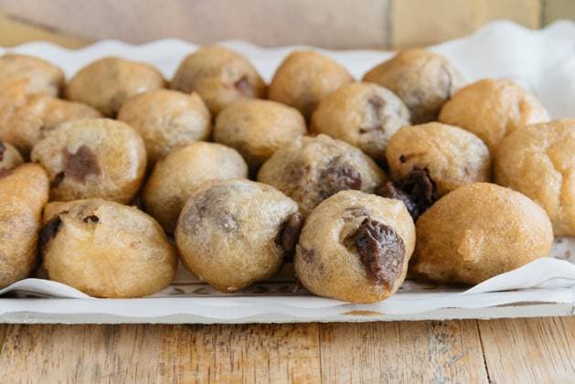Tasty fried sweet pastry Tasty fried sweet pastry or fritters filled with chocolate with sugar, is a typical dessert on Spain. Close up with narrow depth of field Copyright: xZoonar.com @jjfarquitectosx 10432024