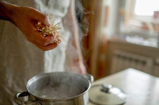 Hand of man adding ingredients in soup model released, Symbolfoto property released, ANAF00437