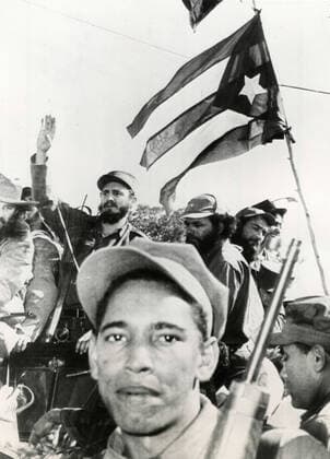 The crowd with Cuban flags greeting Cuban revolutionary Fidel Castro as he enters Havana on January the 8, Cuba 1959 