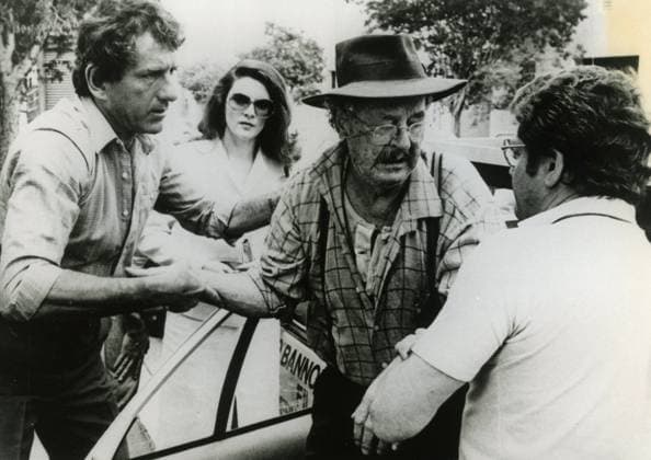 Actors Barry Newman, Willie Fennell, and John Ewart in the movie Deadline, USA 1982 