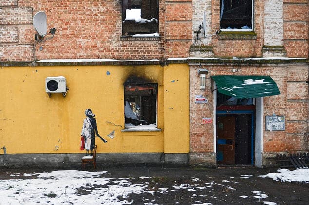 HOSTOMEL, UKRAINE - NOVEMBER 26, 2022 - The mural by England-based street artist Banksy depicts a woman in a gas mask standing on a chair and holding a fire extinguisher, Hostomel, Kyiv Region, northern Ukraine. Banksy?s murals in Kyiv Region  Copyright: xOleksandraxButovax