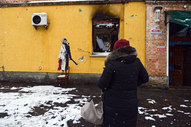 HOSTOMEL, UKRAINE - NOVEMBER 26, 2022 - The mural by England-based street artist Banksy depicts a woman in a gas mask standing on a chair and holding a fire extinguisher, Hostomel, Kyiv Region, northern Ukraine. Banksy?s murals in Kyiv Region  Copyright: xOleksandraxButovax
