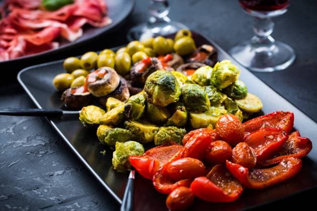Assortment of appetizers and tapas with red wine on black background Assortment of appetizers and tapas with red wine on black background Copyright: xZoonar.com IngridxBalabanovax 17549109