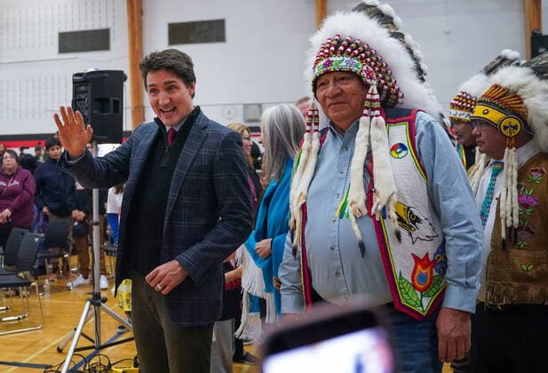 November 28, 2022, James Smith Cree Nation, SK, Canada: Prime Minister Justin Trudeau, left, and Chakastaypasin Chief Calvin Sanderson, right, are introduced at Bernard Constant Community School at James Smith Cree Nation, Sask., Monday, Nov. 28, 2022. James Smith Cree Nation Canada - ZUMAc35_ 20221128_zaf_c35_110 Copyright: xHeywoodxYux