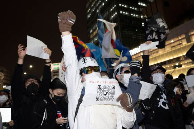 November 30, 2022, Tokyo, Japan: Tokyoites, Hong Kongers, Taiwanese, Uyghurs and Chinese dissidents protest outside Shinjuku Station against President Xi Jingping and the governing Chinese Communist Party s (CCP) draconian Zero-COVID policy after a fire in an ooeroÂ¼mqi, capitol of the Xinjiang Uyghur Autonomous Region, high rise building killed 10 people. The incident sparked the largest wave of civil unrest across China since the 1989 Tiananmen Square Pro-Democracy movement as protesters claim residents were locked into their homes by authorities enforcing strict COVID mandates. Chinese authorities deny these allegations and claim that parked cars delayed firefighters from accessing the building. A blank piece of paper has become the de - ZUMAb177 20221130_zap_b177_013 Copyright: xTaidghxBarronx