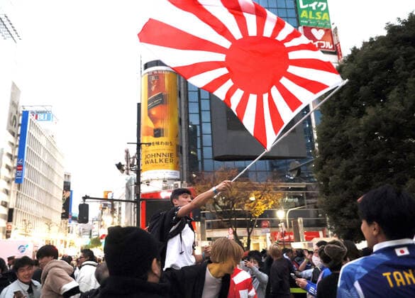 December 2, 2022, Tokyo, Japan - Japanese football fans celebrate Japan s victory at the FIFA World Cup in Qatar against Spain in Tokyo on Friday, December 2, 2022. Japan s national football team defeated Spain 2-1 at the FIFA World Cup preliminary round and advanced to the knock out stage.  , aflo_205283395.jpg,