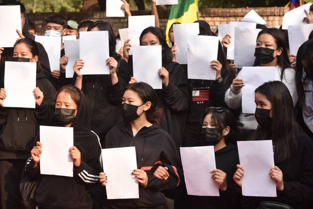 NEW DELHI, INDIA - DECEMBER 2: Tibetan in Exile activists hold blank white paper during protest organized by Tibetan Youth Congress in solidarity with the on-going White Paper protests against Chinese government s continued zero-COVID policies at Jantar Mantar on December 2, 2022 in New Delhi, India. (Photo by Sonu Mehta Hindustan Times) Tibetan Youth Congress In India Protest In Support Zero Covid Protesters In ChinaTibetan Youth Congress In India Protest In Support Zero Covid Protesters In China