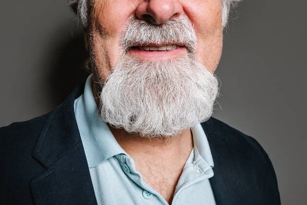 Crop close up half view of Aged bearded gray haired male in elegant clothes standing against gray background, Model released HodeiUnzueta_ID7769_234906_001 Copyright: xHodeixUnzuetax MR