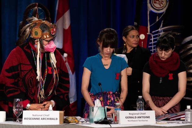 December 7, 2022, Ottawa, ON, Canada: Assembly of First Nations (AFN) National Chief, RoseAnne Archibald, left, stands as Cambria Harris, centre, and Kera Harris receive a standing ovation following their respective speeches in honour of their mother, Morgan Harris, who was killed by an alleged serial killer in Winnipeg, but her body has not yet been found in Ottawa, on Wednesday, Dec. 7, 2022. Ottawa Canada  - ZUMAc35_ 20221207_zaf_c35_132 Copyright: xSpencerxColbyx