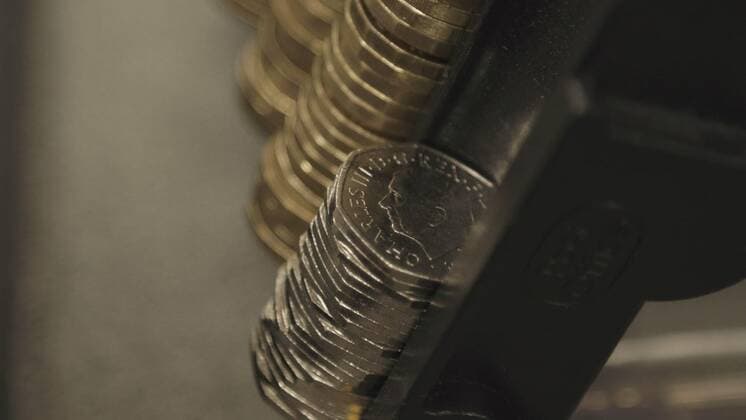 **VIDEO AVAILABLE: CONTACT INFO@COVERMG.COM TO RECEIVE** The first coins bearing the image of King Charles III have started to appear in circulation in Post Offices around the UK on Thursday 8 December 2022. The Royal Mint had previously announced first coin to bear The King?s portrait and mark the historic transition from Queen Elizabeth II to King Charles III in the public?s change is a 50 pence commemorating the life and legacy of Her Late Majesty Queen Elizabeth on the reverse (tails side). A commemorative version of the coin was released in October and saw record visitors to The Royal Mint?s website over the next 24 hours. From Thursday, Post Office branches throughout the country will receive 4.9 million 50 pence coin Copyright: xx 52262703 EDITORIAL USE ONLY. NOT FOR USE BY NEWSPAPERS BASED IN THE UK.
