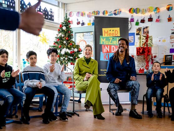 08-12-2022 Haarlem Queen Maxima with Jeangu Macrooy at the More Music in the Classroom at the OBS De Globe school, one of the participant in the largest school band in the Netherlands, in Haarlem. The Queen attended a music class by the Flying Brigadier, Andre Accord. Â  Copyright: xPPEx