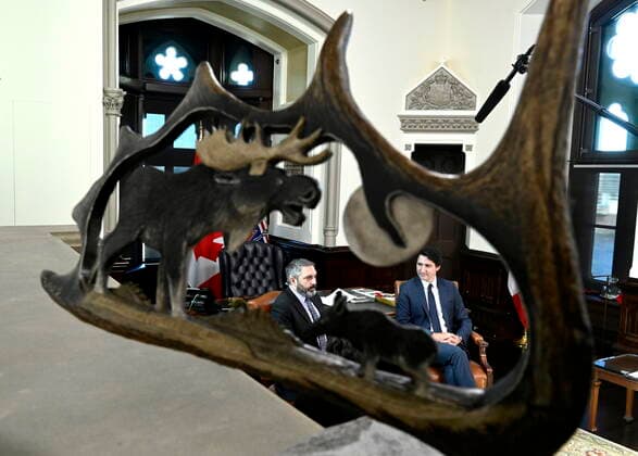 December 9, 2022, Ottawa, ON, CAN: Prime Minister Justin Trudeau and with Yukon Premier Sandy Silver are seen past a carving during a meeting in Trudeau s office in West Block on Parliament Hill in Ottawa, on Friday, Dec. 9, 2022. Ottawa CAN  - ZUMAc35_ 20221209_zaf_c35_036 Copyright: xJustinxTangx