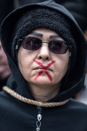 December 10, 2022, Istanbul, Turkey: A mouth of a protesting woman is painted red in the shape of a cross during the demonstration. Mahsa Amini s death has sparked weeks of violent protests across Iran and other countries. Mahsa fell into a coma and died after being arrested in Tehran by the morality police for allegedly violating the country s hijab rules. In the trials regarding the protests, 11 people have been sentenced to death so far. Istanbul Turkey - ZUMAs197 20221210_zaa_s197_159 Copyright: xOnurxDogmanx