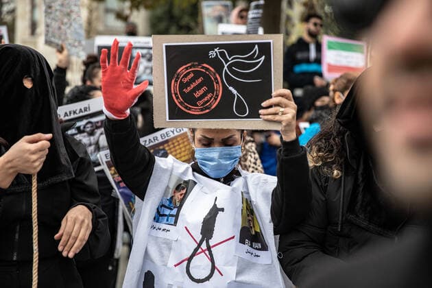 December 10, 2022, Istanbul, Turkey: Protester chants slogans during the demonstration. Mahsa Amini s death has sparked weeks of violent protests across Iran and other countries. Mahsa fell into a coma and died after being arrested in Tehran by the morality police for allegedly violating the country s hijab rules. In the trials regarding the protests, 11 people have been sentenced to death so far. Istanbul Turkey - ZUMAs197 20221210_zaa_s197_169 Copyright: xOnurxDogmanx