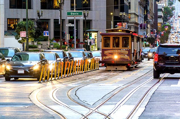 RECORD DATE NOT STATED traditional cable car in the traffic of San Francisco , 23284946.jpg, america, antique, authentic, bay, bus, cable, california, car, city, famous, francisco, green, hill, historic, landmark, operating, passenger, people, public, rail, retro, san, sf, states, street, streetcar, style, tourist, track, traffic, train, tram, transit, transport, transportation, travel, trolley, urban, usa, vacation, vintage, west, western, wooden,