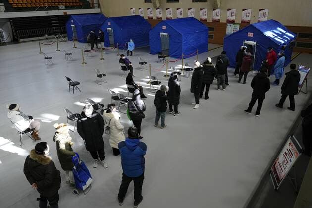 Scene in China People line up for fever outpatient services in a gym in Beijing on Dec. 15, 2022, after China recently eased its zero-COVID policy.  A14AA0001375996P