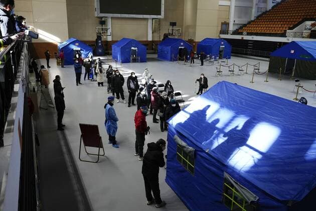 Scene in China People line up for fever outpatient services in a gym in Beijing on Dec. 15, 2022, after China recently eased its zero-COVID policy.  A14AA0001375997P