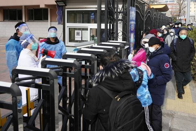 Scene in China People line up for fever outpatient services at a gym in Beijing on Dec. 15, 2022, after China recently eased its zero-COVID policy.  A14AA0001375998P