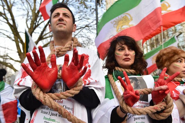 December 17, 2022, London, England, United Kingdom: Protesters take part in a demonstration in central London, calling to stop executions of protesters in Iran, and in solidarity with the freedom uprising in Iran, over the death of Mahsa Amini in custody, by Iranian morality police. Mahsa Amini was killed on 16 September, after her arrest for allegedly breaching Iran s laws for women on wearing hijab, headscarves and modest clothing. London United Kingdom - ZUMAk172 20221217_zip_k172_008 Copyright: xThomasxKrychx