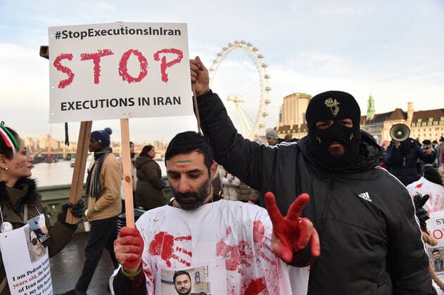 December 17, 2022, London, England, United Kingdom: Protesters take part in a demonstration in central London, calling to stop executions of protesters in Iran, and in solidarity with the freedom uprising in Iran, over the death of Mahsa Amini in custody, by Iranian morality police. Mahsa Amini was killed on 16 September, after her arrest for allegedly breaching Iran s laws for women on wearing hijab, headscarves and modest clothing. London United Kingdom - ZUMAk172 20221217_zip_k172_014 Copyright: xThomasxKrychx