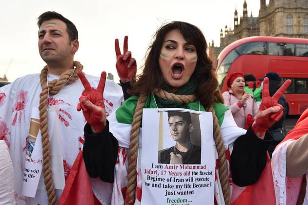 December 17, 2022, London, England, United Kingdom: Protesters take part in a demonstration in central London, calling to stop executions of protesters in Iran, and in solidarity with the freedom uprising in Iran, over the death of Mahsa Amini in custody, by Iranian morality police. Mahsa Amini was killed on 16 September, after her arrest for allegedly breaching Iran s laws for women on wearing hijab, headscarves and modest clothing. London United Kingdom - ZUMAk172 20221217_zip_k172_017 Copyright: xThomasxKrychx